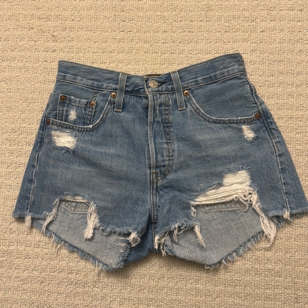 Levi’s high waisted distressed light denim jean shorts